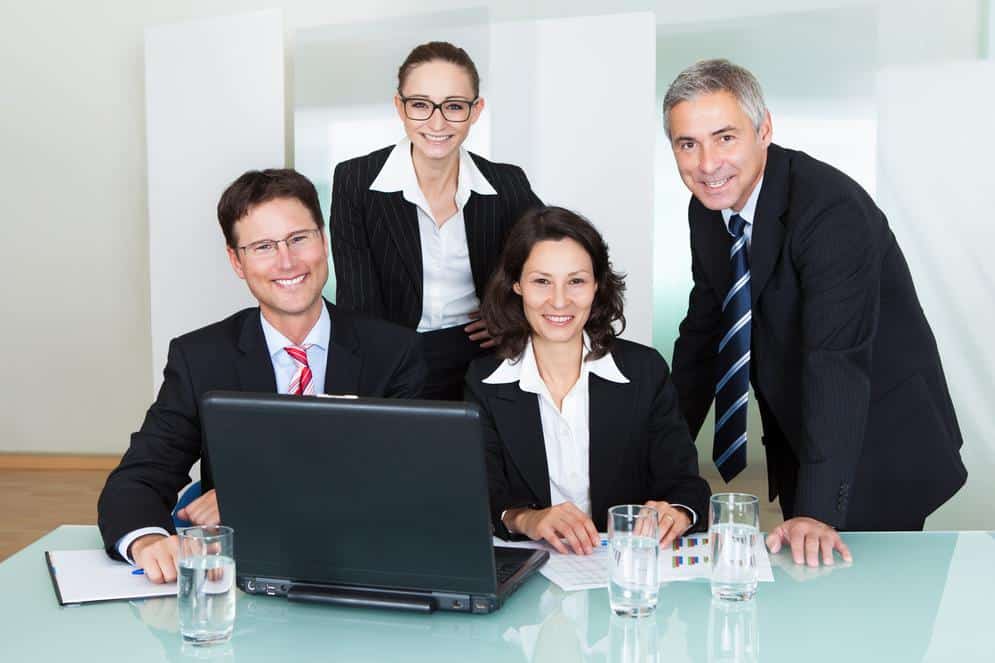 Smiling successful business team smiling business team